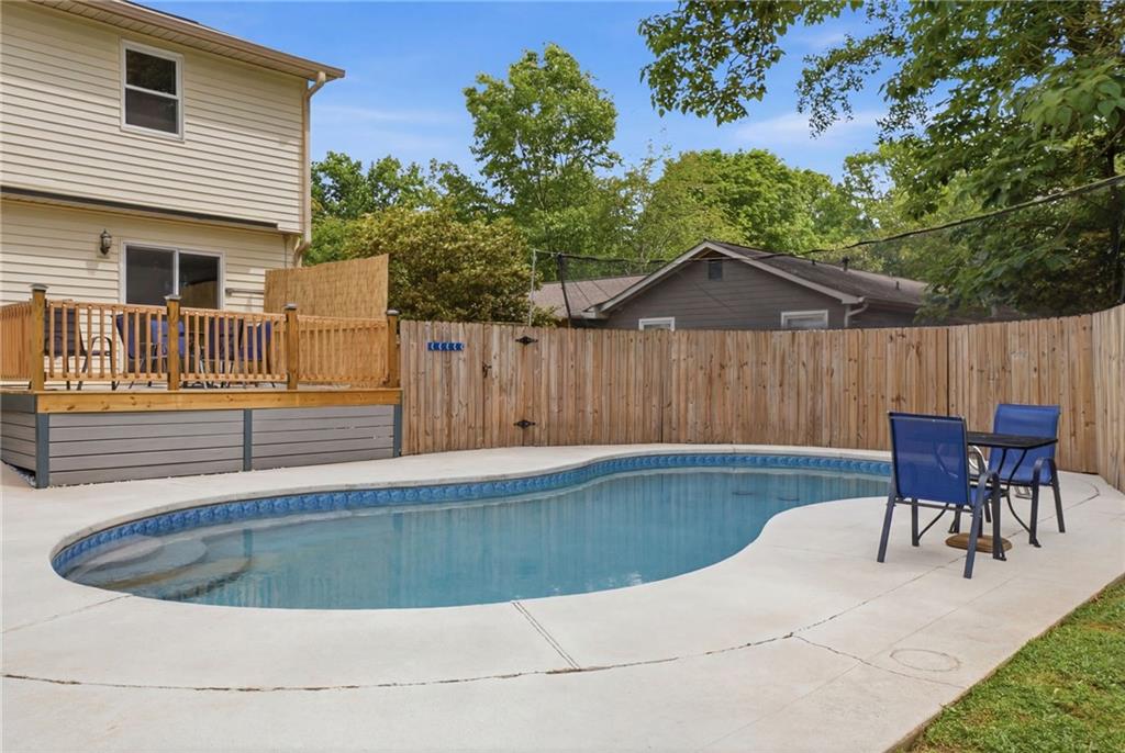 338 Arbour Way Suwanee, GA 30024 - Photo 23 of 32 a view of a house with backyard and sitting area