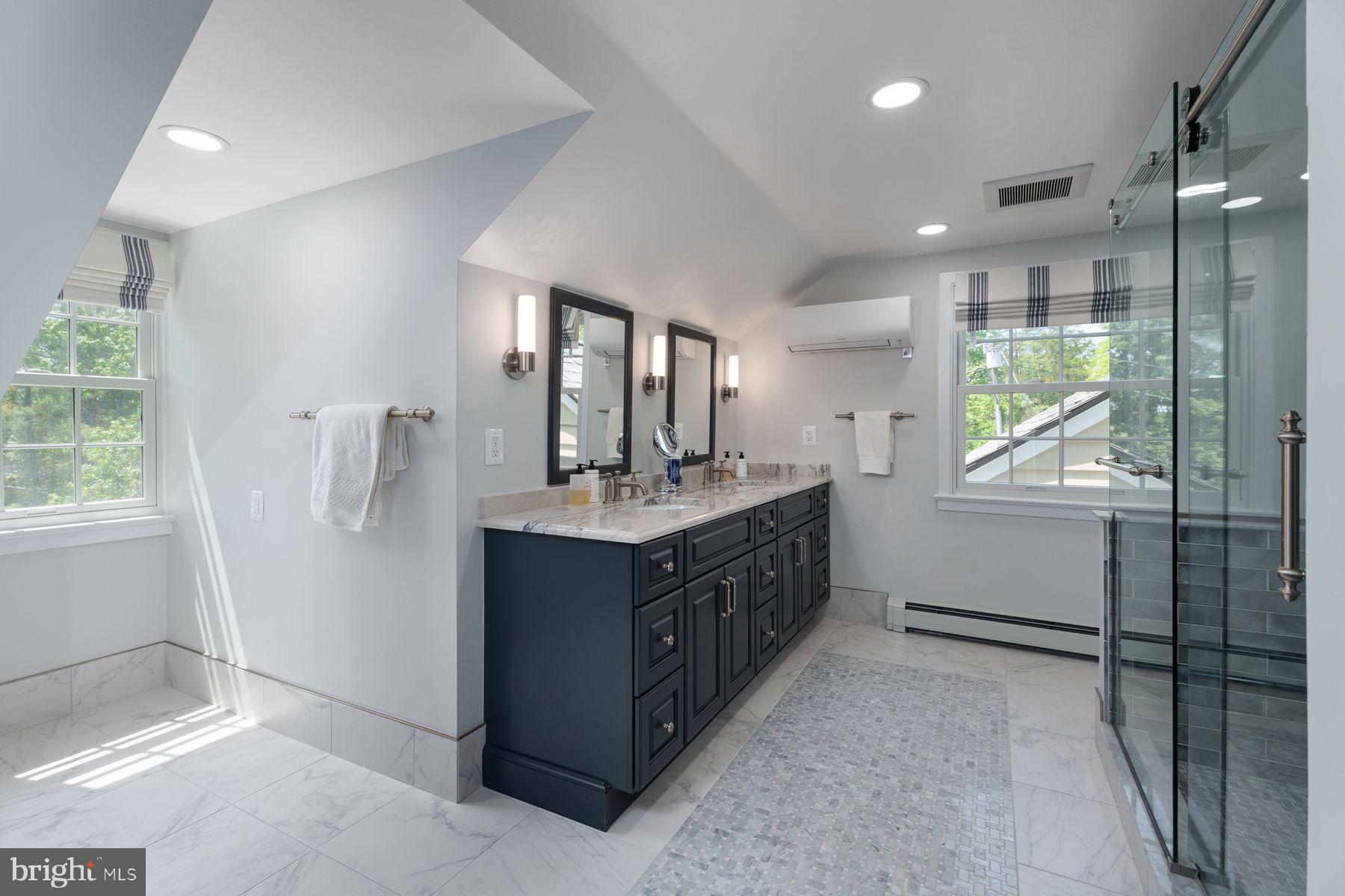 821 Pretty Brook Road Princeton, NJ 08540 - Photo 23 of 32 a bathroom with a double vanity sink and mirror
