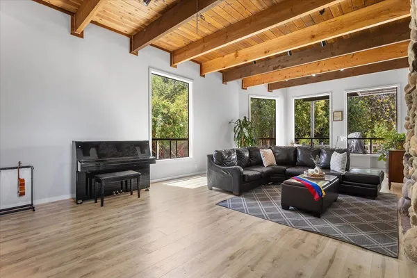 a living room with furniture and a large window