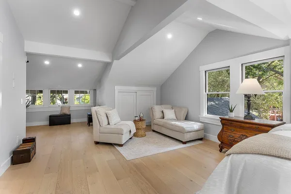 a white kitchen with sink and window