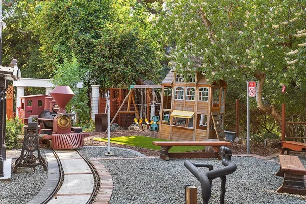 a kitchen with a sink cabinets and wooden floor