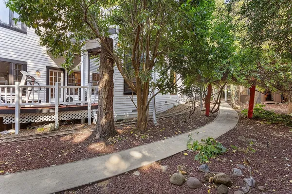 a patio with patio door and outdoor seating