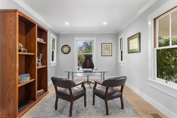 a view of a dining room with furniture and window