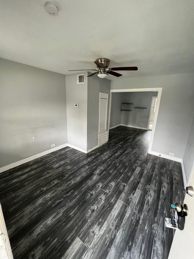 3012 Live Oak Street Houston, TX 77004 - Photo 2 of 6 a view of empty room with wooden floor