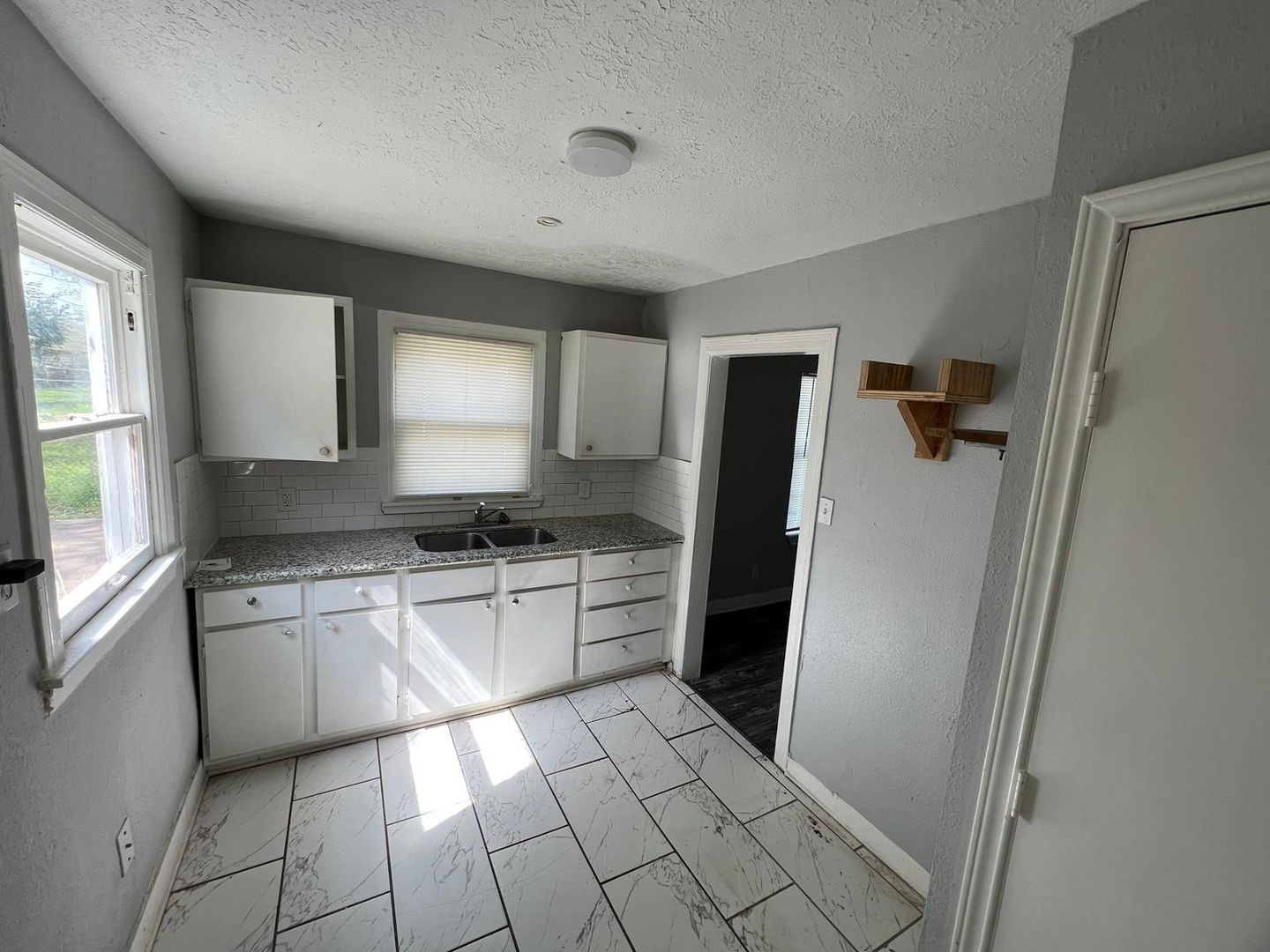 3012 Live Oak Street Houston, TX 77004 - Photo 4 of 6 a kitchen with a refrigerator a sink and a stove top oven