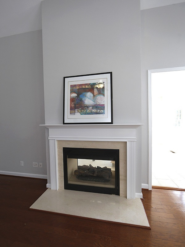 3324 Queensland Road Raleigh, NC 27614 - Photo 12 of 25 The fireplace goes through to the sunroom. Multi-media outlets are above and beside the fireplace. Fireplace
