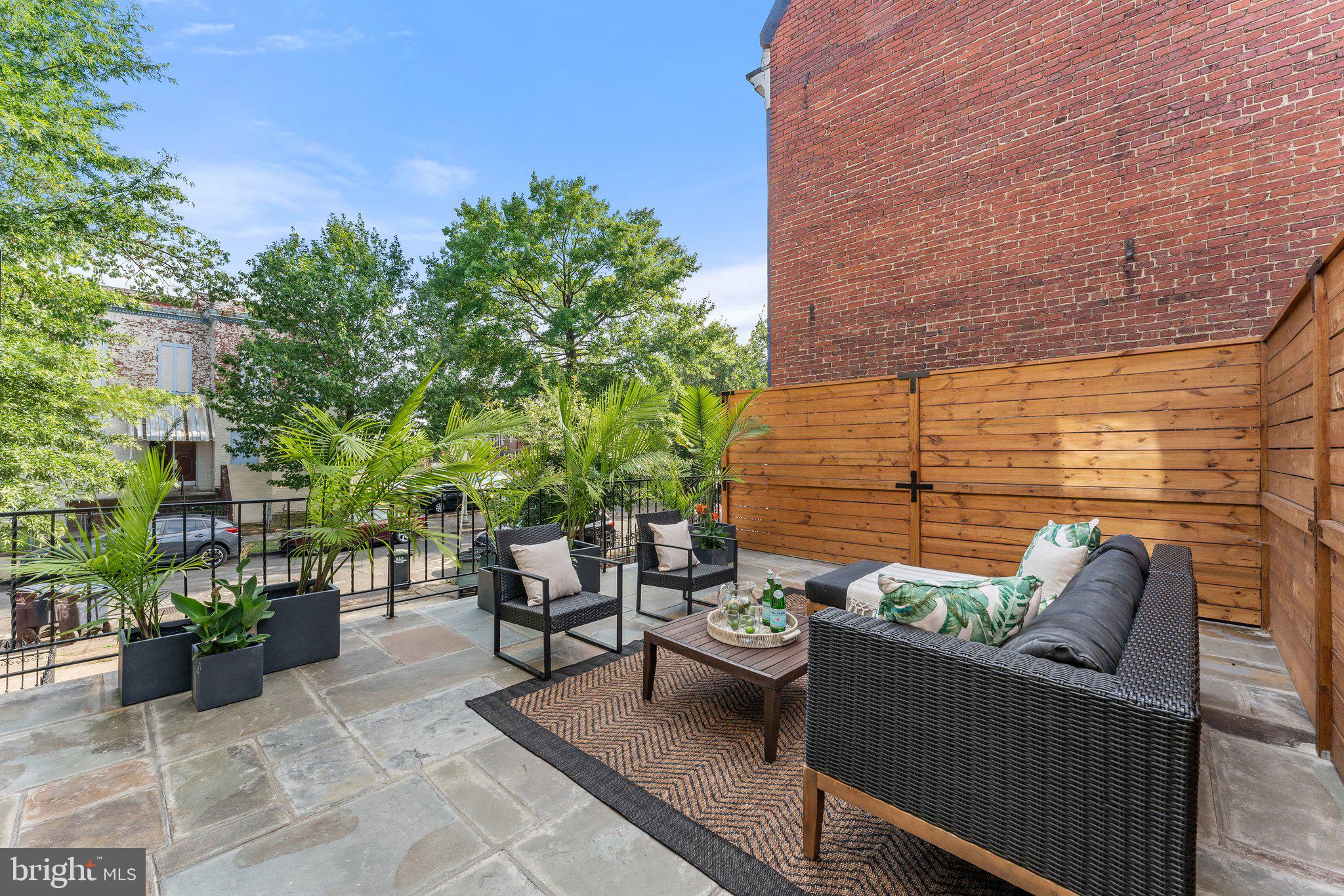900 8th Street Northeast Washington, DC 20002 - Photo 15 of 50 a view of a patio with couches and potted plants