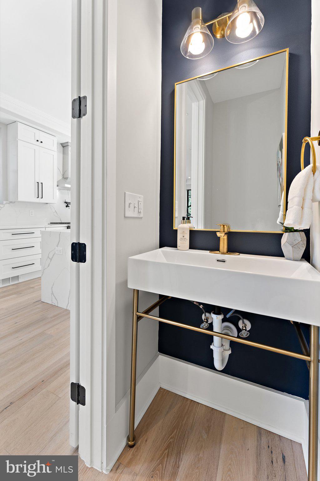 900 8th Street Northeast Washington, DC 20002 - Photo 21 of 50 a bathroom with a sink and a mirror