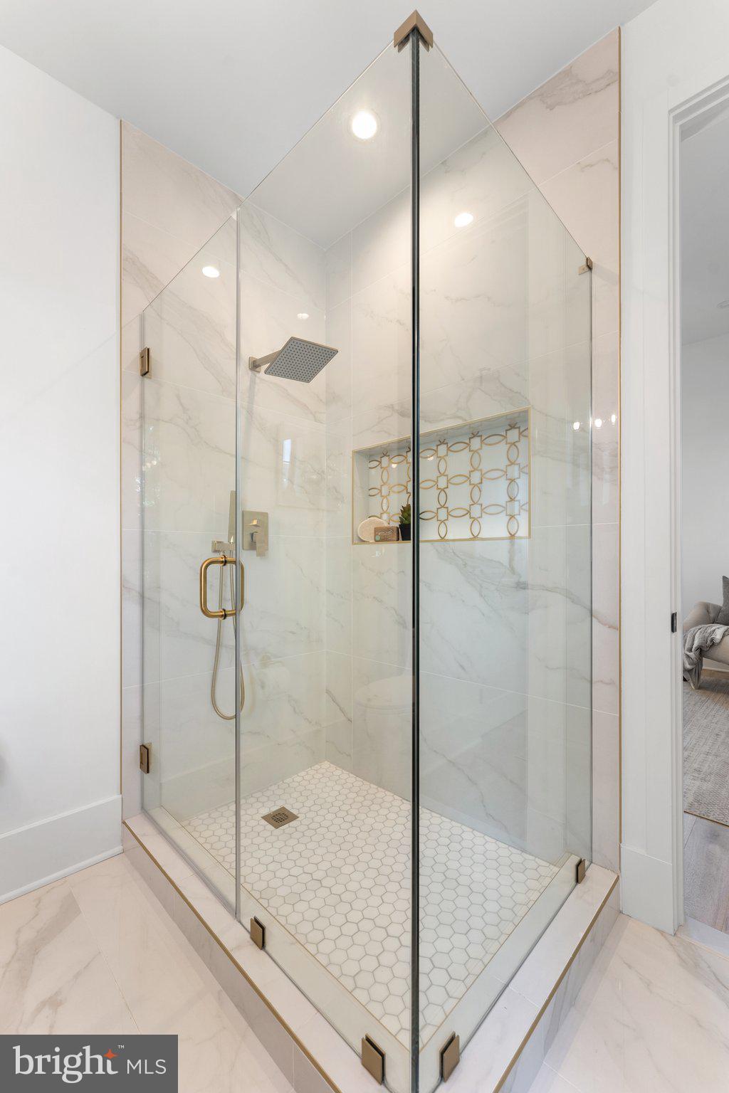 900 8th Street Northeast Washington, DC 20002 - Photo 28 of 50 a bathroom with a glass shower door and a glass door