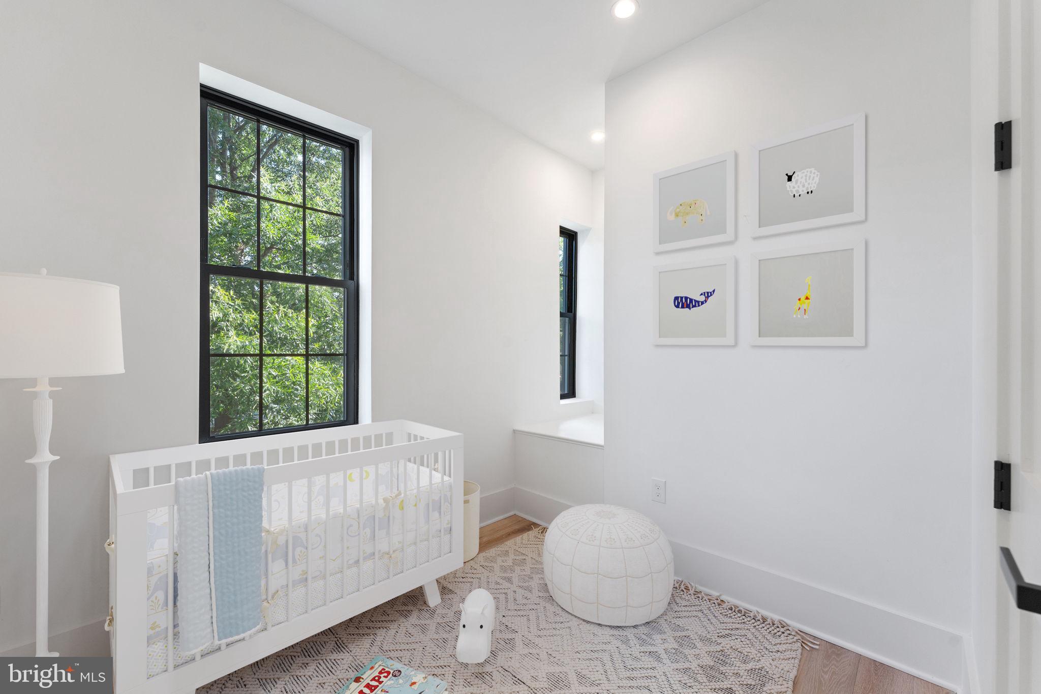 900 8th Street Northeast Washington, DC 20002 - Photo 29 of 50 a bedroom with a bed and a window