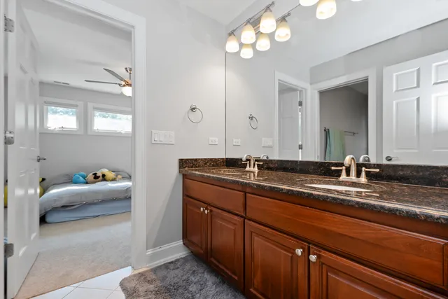 a bathroom with a sink double vanity and a mirror