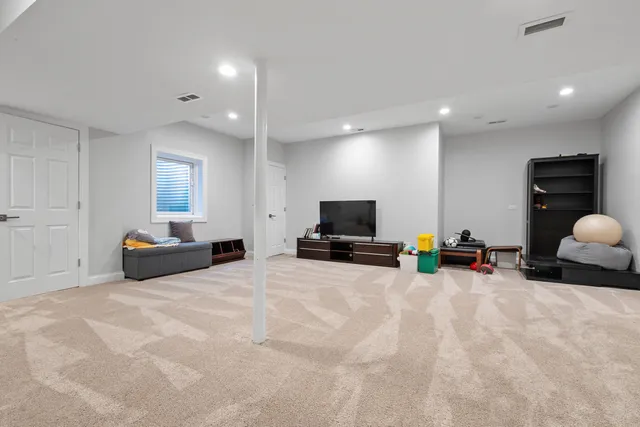 a view of a livingroom with furniture and a flat screen tv