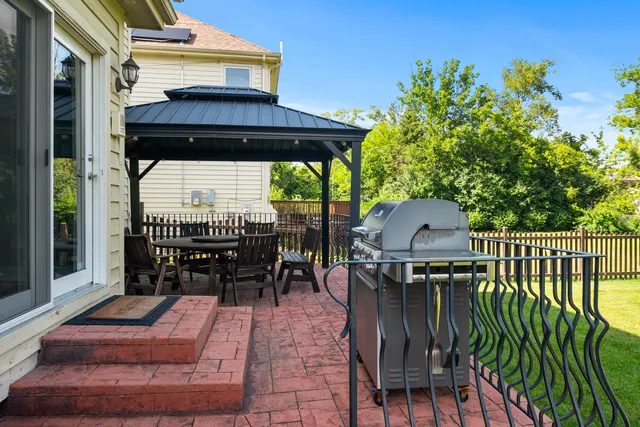a view of a chairs and table in the balcony