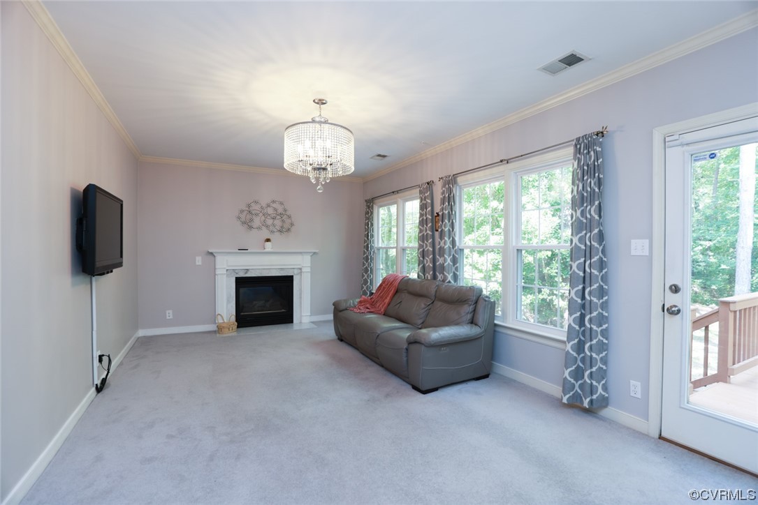 13906 Sagebrook Road Midlothian, VA 23112 - Photo 15 of 50 a living room with furniture a fireplace and a flat screen tv