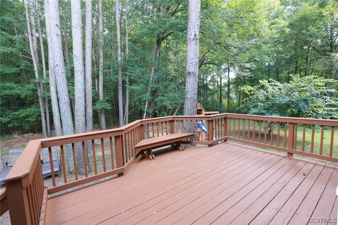 13906 Sagebrook Road Midlothian, VA 23112 - Photo 34 of 50 a view of a wooden deck with a yard