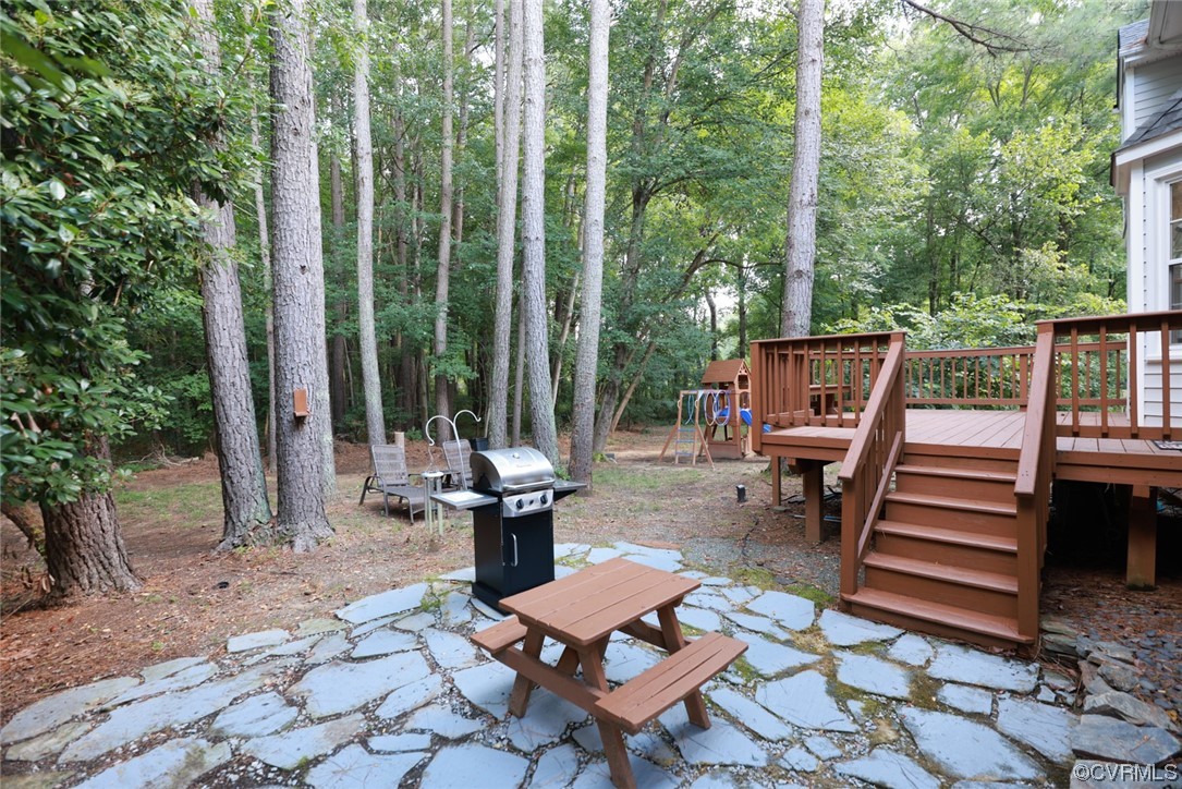 13906 Sagebrook Road Midlothian, VA 23112 - Photo 36 of 50 a view of a patio with wooden chairs and table
