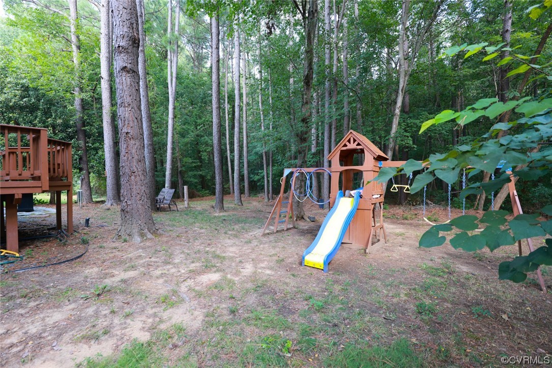 13906 Sagebrook Road Midlothian, VA 23112 - Photo 38 of 50 a wooden deck with a slide