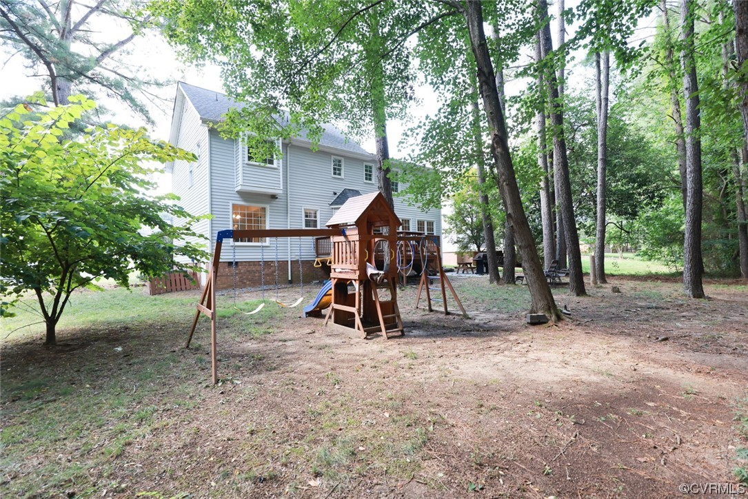 13906 Sagebrook Road Midlothian, VA 23112 - Photo 39 of 50 a view of outdoor space with trampoline