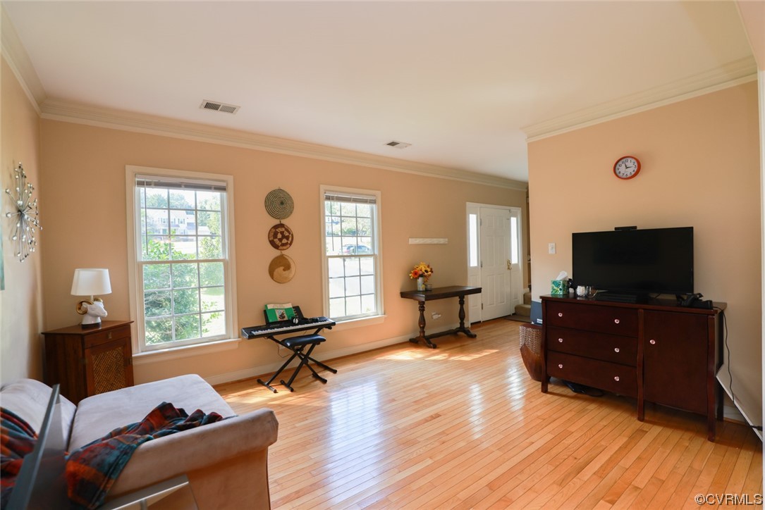 13906 Sagebrook Road Midlothian, VA 23112 - Photo 5 of 50 a living room with furniture and a flat screen tv