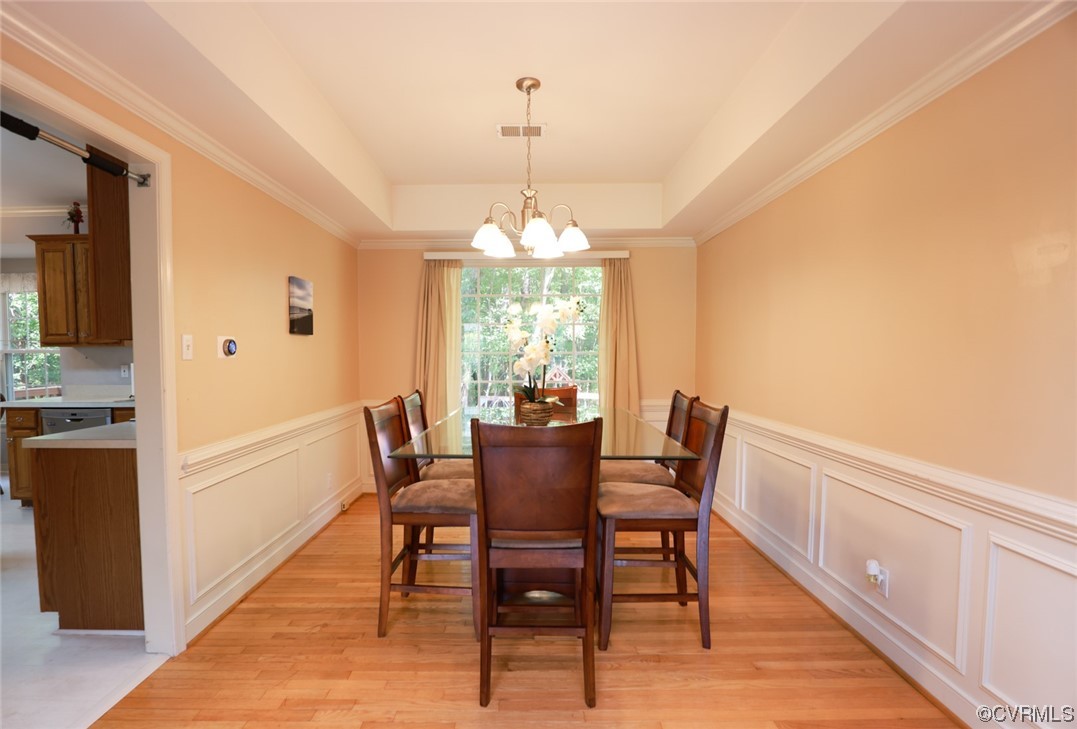 13906 Sagebrook Road Midlothian, VA 23112 - Photo 6 of 50 a dining room with furniture a chandelier and wooden floor