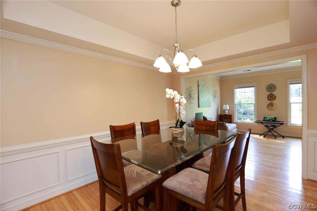 13906 Sagebrook Road Midlothian, VA 23112 - Photo 7 of 50 a view of a dining room with furniture and wooden floor