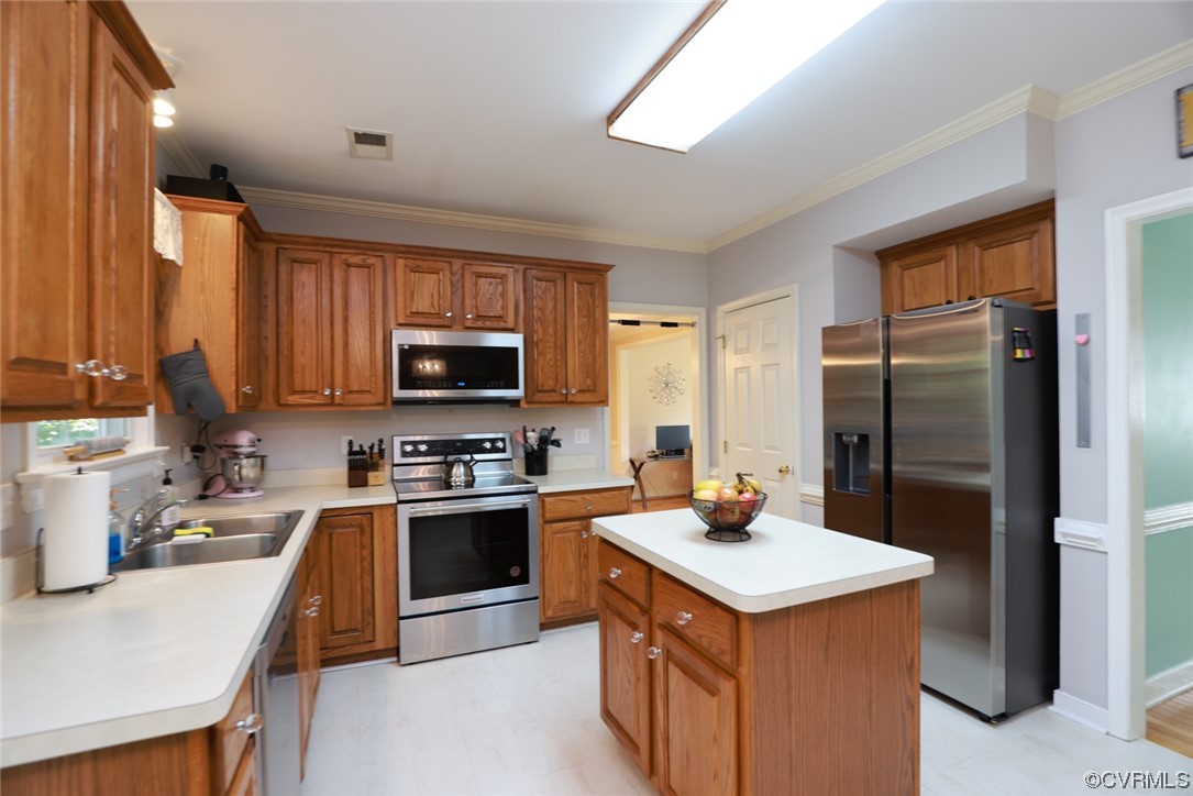 13906 Sagebrook Road Midlothian, VA 23112 - Photo 9 of 50 a kitchen with a stove a refrigerator and a sink