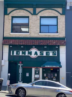 a front view of a building with glass windows