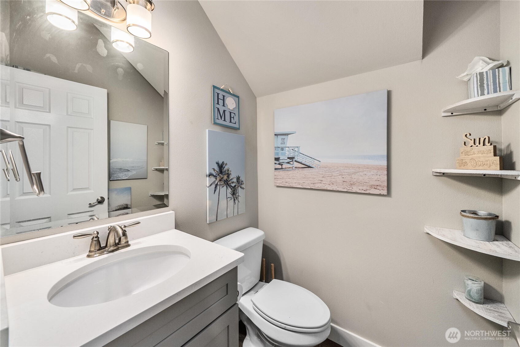 61 East Brady Loop Allyn, WA 98524 - Photo 12 of 27 a bathroom with a sink a toilet and a mirror