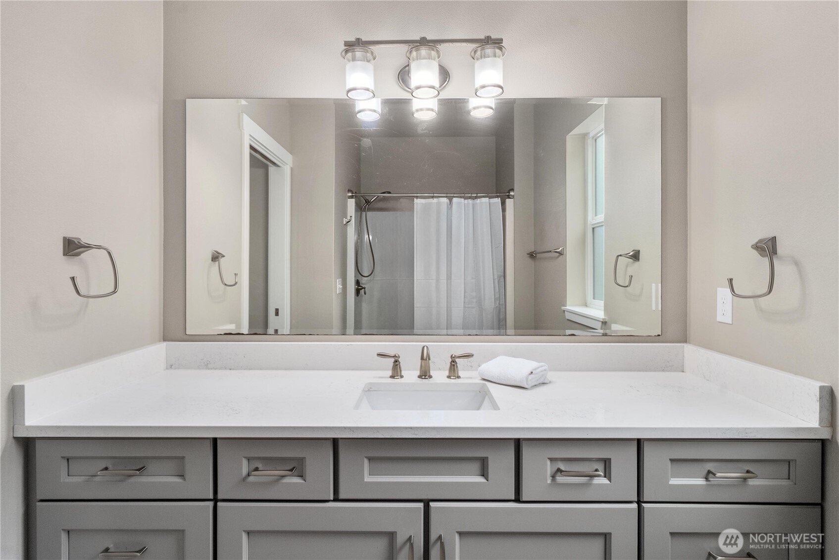 61 East Brady Loop Allyn, WA 98524 - Photo 15 of 27 a bathroom with a sink vanity and a mirror