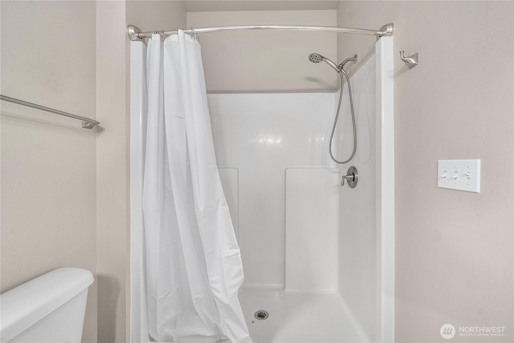 61 East Brady Loop Allyn, WA 98524 - Photo 16 of 27 a bathroom with a shower curtain and a shower curtain