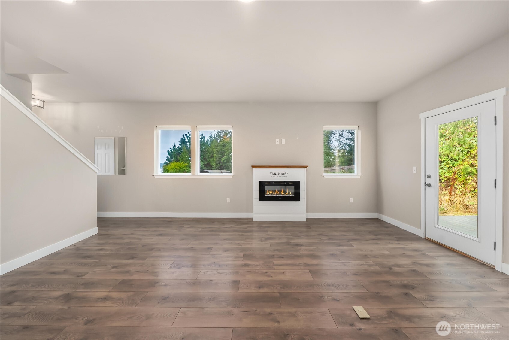 61 East Brady Loop Allyn, WA 98524 - Photo 5 of 27 a view of an empty room with window and fire place