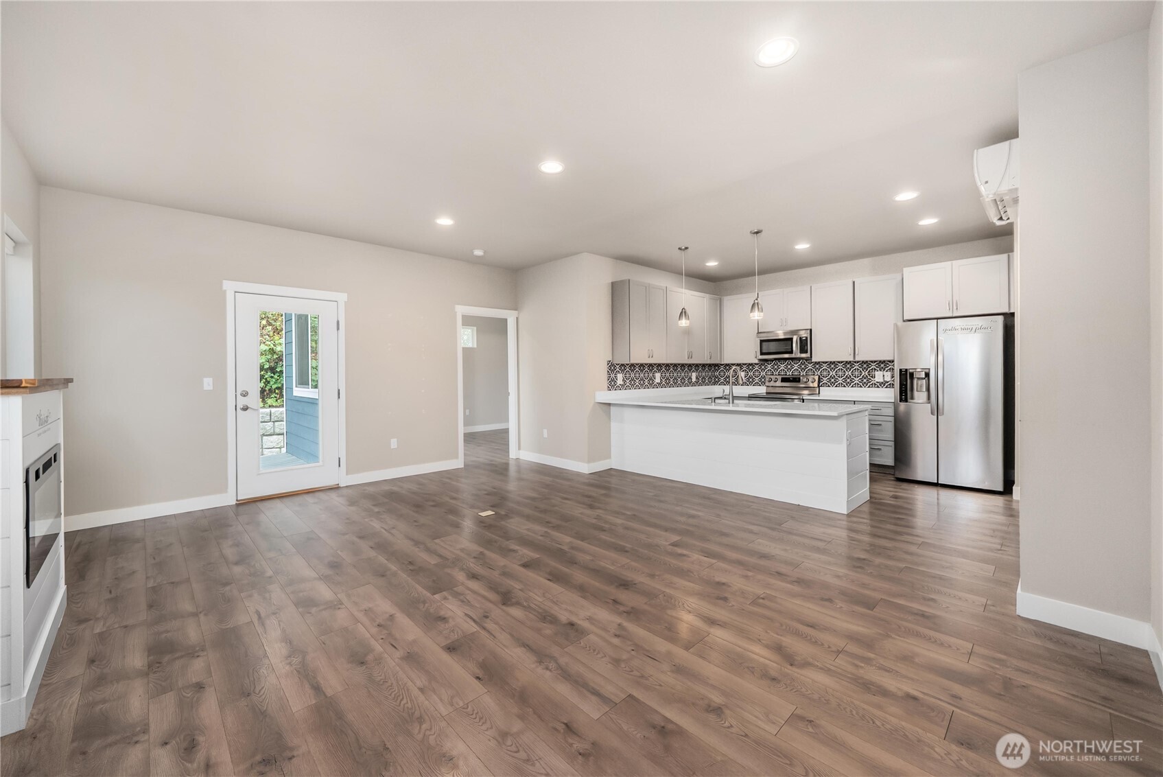 61 East Brady Loop Allyn, WA 98524 - Photo 10 of 27 a view of kitchen with wooden floor