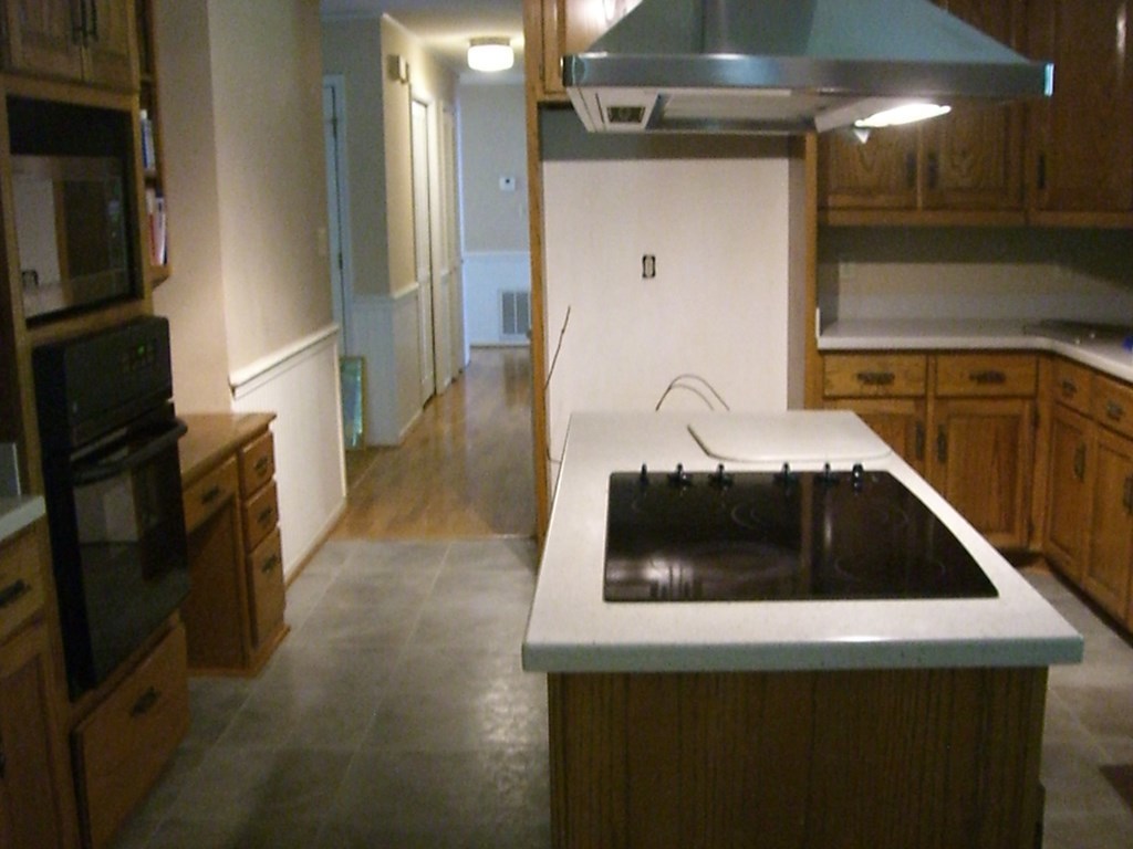 230 Woodland Road Gray, GA 31032 - Photo 14 of 20 a kitchen with a sink and a refrigerator