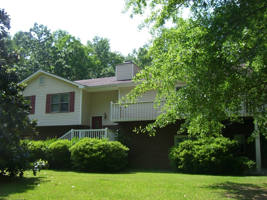 230 Woodland Road Gray, GA 31032 - Photo 3 of 20 a front view of a house with garden