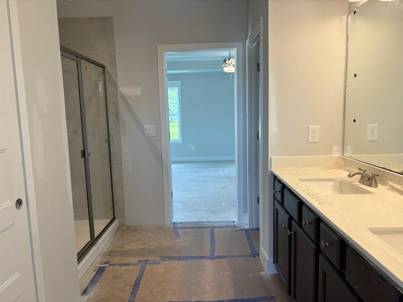 6 Commons Way Cartersville, GA 30120 - Photo 14 of 37 a bathroom with a granite countertop sink and a mirror