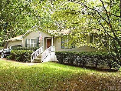 6812 Chamonix Place Raleigh, NC 27613 - Photo 1 of 1 a front view of a house with garden