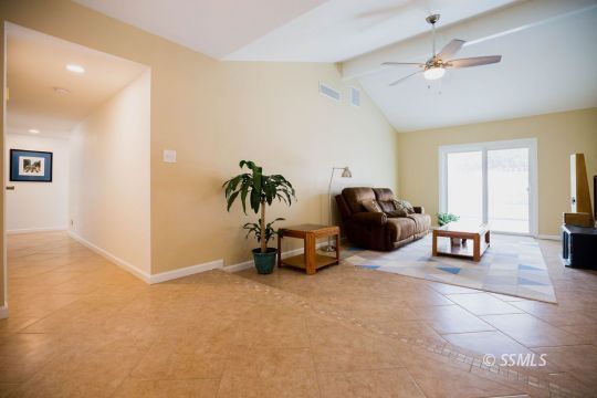 737 Peg Street Ridgecrest, CA 93555 - Photo 7 of 43 a living room with furniture and a lamp