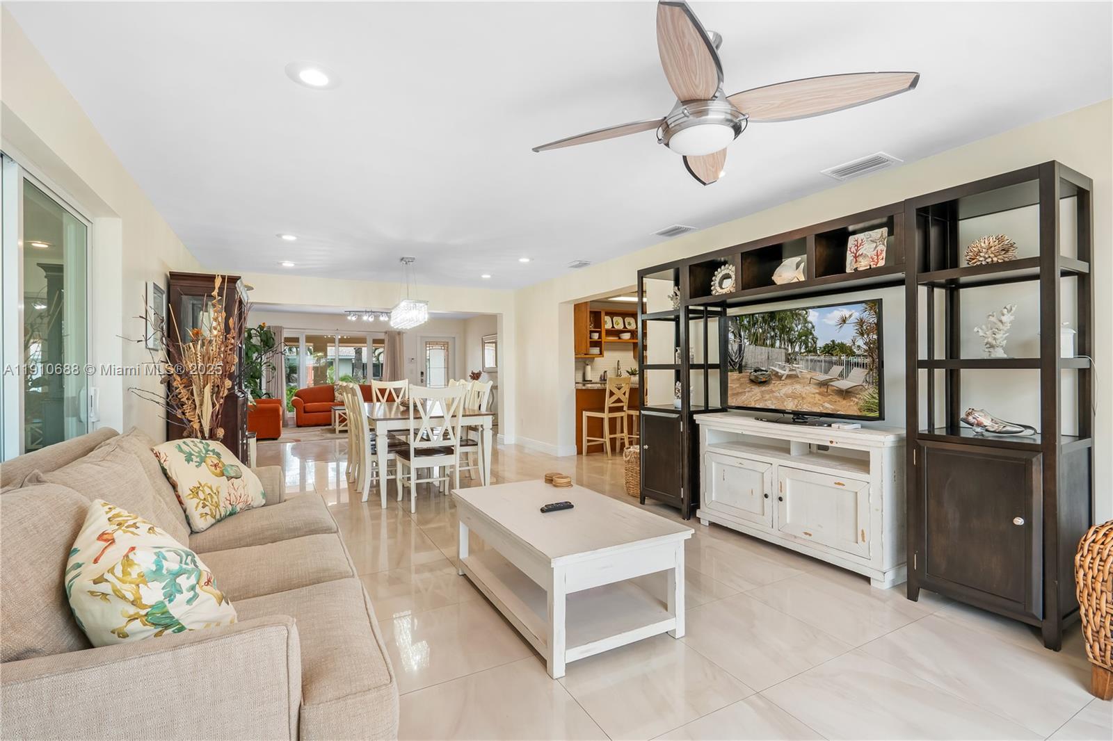 281 Southeast 3rd Court Pompano Beach, FL 33060 - Photo 12 of 39 a living room with furniture and kitchen view