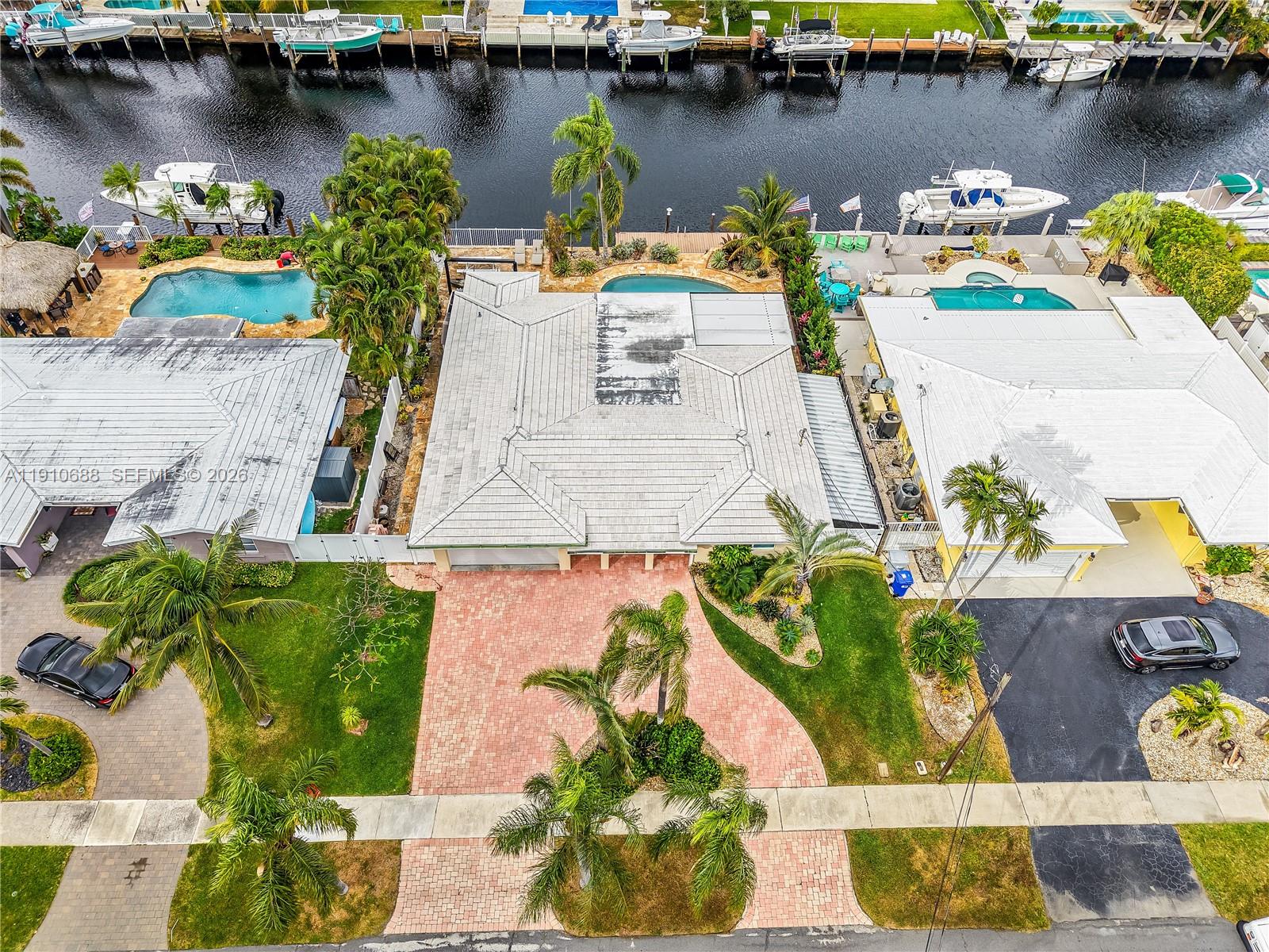 281 Southeast 3rd Court Pompano Beach, FL 33060 - Photo 2 of 39 an aerial view of a house with outdoor space and a lake view