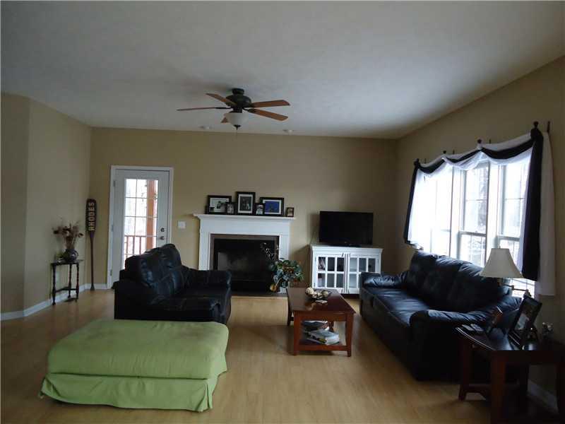 152 Hanny Beaver Road Hookstown, PA 15050 - Photo 5 of 25 Living Room. First floor living rom featuring maple laminate wood flooring, High ceilings, and plenty of natural light