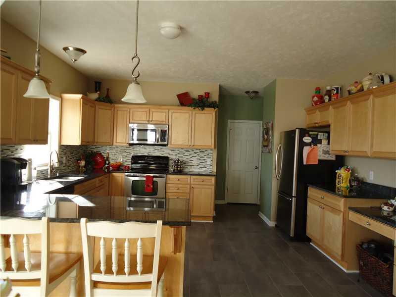 152 Hanny Beaver Road Hookstown, PA 15050 - Photo 8 of 25 Kitchen. Large kitchen featuring maple cabinetry, granite counters and stainless steel appliances.