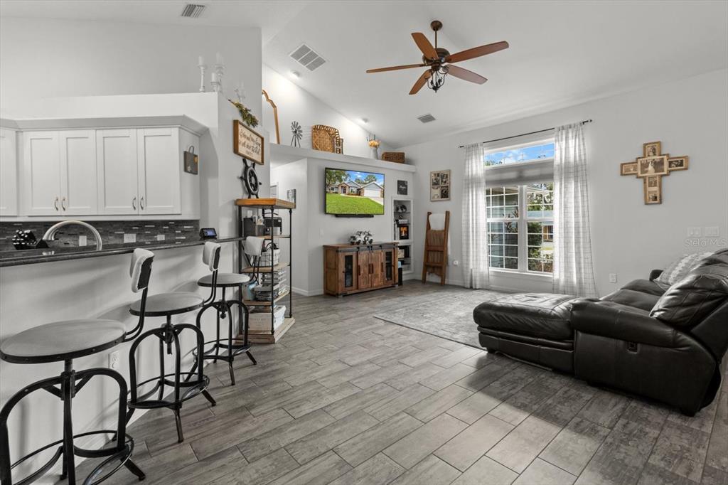 5317 West Tortuga Loop Lecanto, FL 34461 - Photo 15 of 37 a living room with furniture and wooden floor