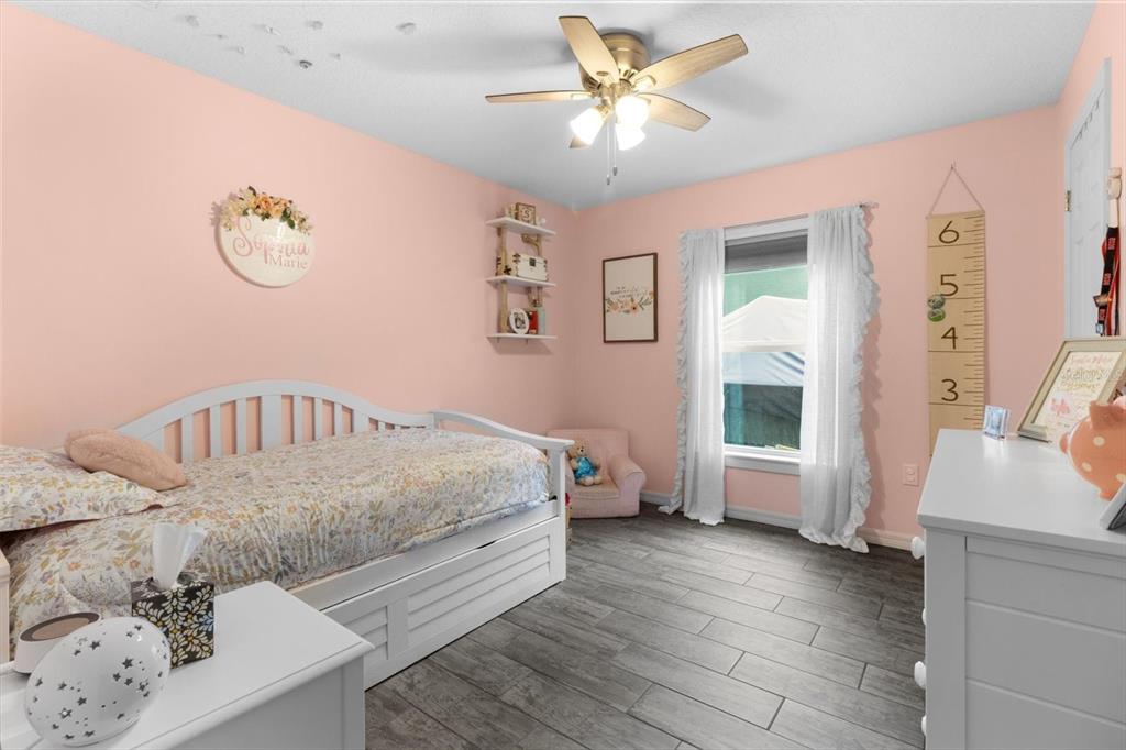 5317 West Tortuga Loop Lecanto, FL 34461 - Photo 16 of 37 a spacious bedroom with a bed and a window