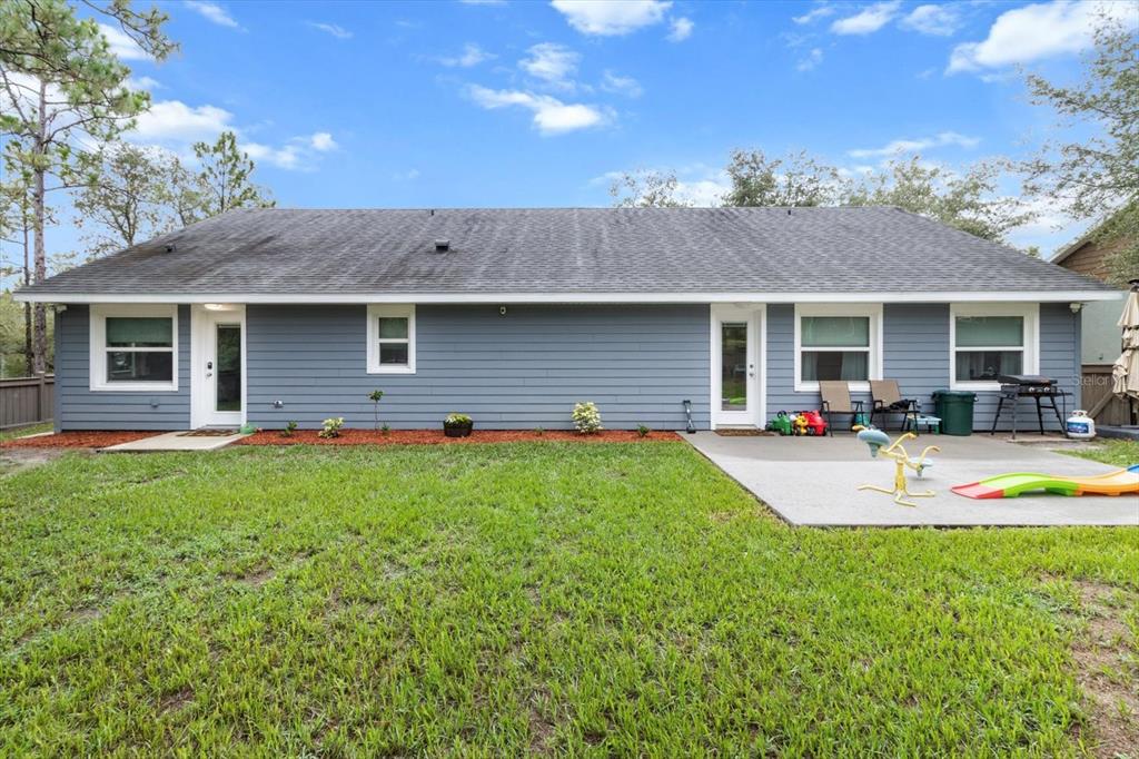 5317 West Tortuga Loop Lecanto, FL 34461 - Photo 29 of 37 a view of a house with backyard and porch