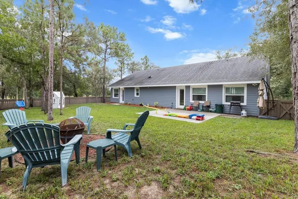 a view of a house with backyard porch and patio
