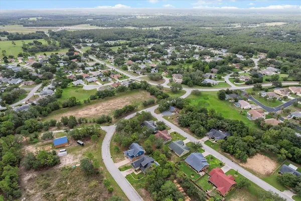 an aerial view of city and lake