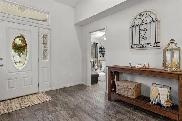 a view of living room with furniture and wooden floor