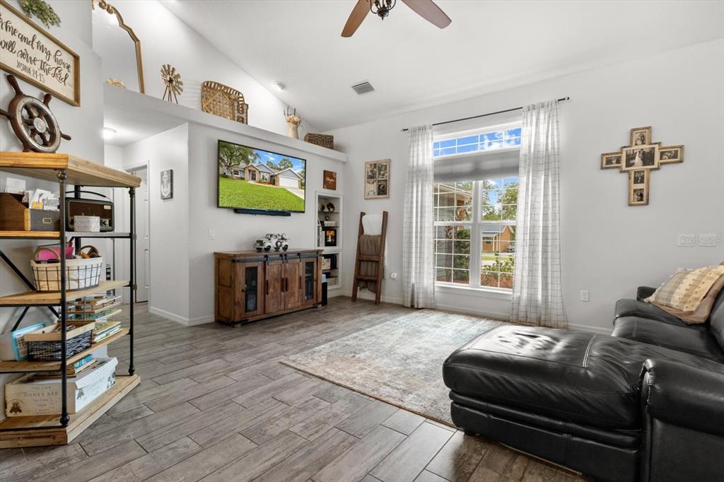 5317 West Tortuga Loop Lecanto, FL 34461 - Photo 7 of 37 a living room with furniture and a flat screen tv