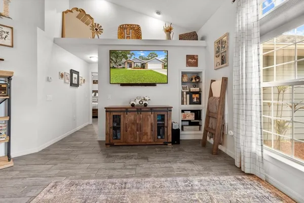 a view of living room with furniture and a flat screen tv