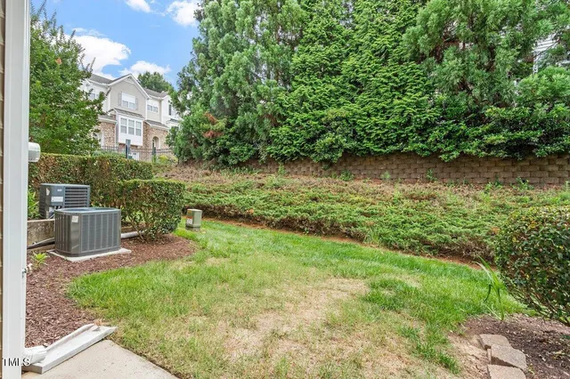 a view of a chairs in a backyard of a house